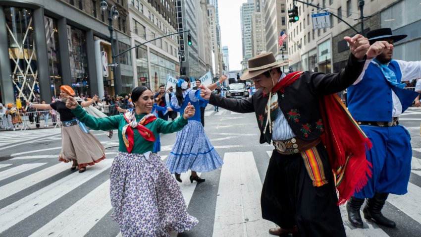 MANHATTAN, NY – OCTOBER 13: Marchers dance together down 5th Avenue in traditional costumes during the 55th Hispanic Day Parade.  The parade walked down 5th Avenue in the Manhattan borough of New York on October 13, 2019, USA.  (Photo by Ira L. Black/Corbis via Getty Images)