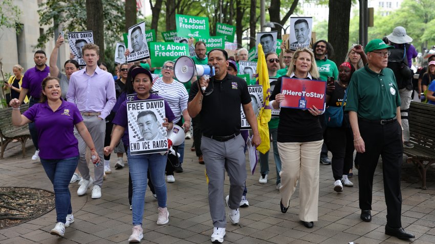 Jaime Contreras, Executive Vice President of SEIU labor union 32BJ, center, leads an immigrant rights march outside of the Department of Justice headquarters in Washington, D.C. on June 9, 2025. Around 1,000 demonstrators called for an end to national ICE raids and for the release of SEIU-USWW President David Huerta, who was injured and detained by federal agents during protests in Los Angeles, (Photo by Bryan Dozier / Middle East Images via AFP) (Photo by BRYAN DOZIER/Middle East Images/AFP via Getty Images)